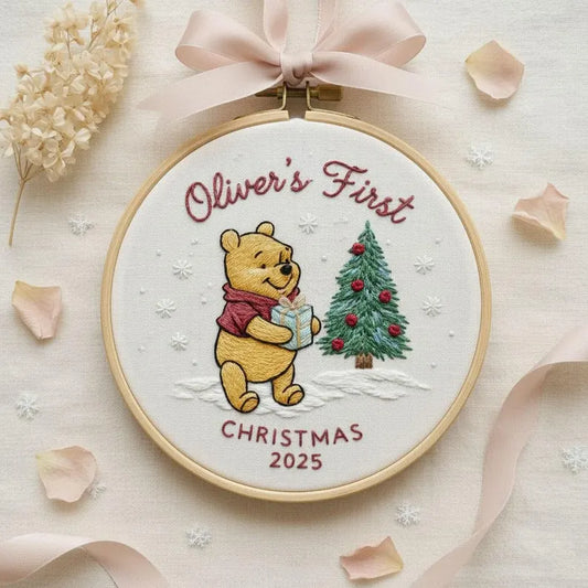 Welcome your little one’s magical holiday with our Personalized Classic Pooh Embroidered Ornament — a sweet keepsake made to celebrate your baby’s very first Christmas.
Each hoop features charming embroidery of Pooh with a festive Christmas tree, gently stitched on premium fabric to create a warm, nostalgic look.
Customize with your baby’s name and year to turn it into a timeless treasure. Whether it’s a gift for new parents, a nursery decoration, or a memory for the family tree, this ornament adds the per