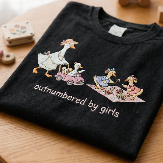 Angled Closeup Of Outnumbered By Girls Goose Embroidery