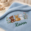 Light blue blanket with woodland animals and Raven name