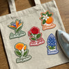 State Flower Iron-On Patches Displayed On Canvas Tote
