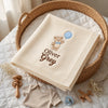 Cream Personalized Blanket Folded Inside A Wicker Moses Basket