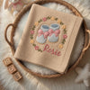 Beige Rosie Booties Blanket Folded Inside Wicker Basket