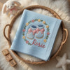 Light Blue Rosie Booties Blanket Displayed With Wooden Name Blocks