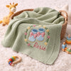 Mung Bean Rosie Booties Blanket Styled With Nursery Toys