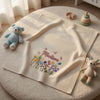 Begie Madison Blanket Displayed With Soft Toys And Flowers