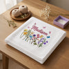 White Butterfly Bloom Blanket Folded Beside Embroidery Supplies