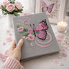 Gray Embroidered Butterfly Notebook Held In Romantic Setting