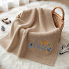 Beige Personalized Space Blanket Draped Over Nursery Basket