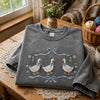 Grey Cottage Geese Shirt Styled Beside Yarn And Wildflowers