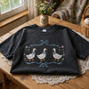 Folded Black Cottage Geese Tee With Blue Bows And Flowers