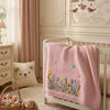 Pink Embroidered Blanket Draped On Crib