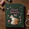 Dark Green Bunny And Bear Notebook Beside Embroidery Hoop