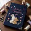 Navy Keepsake Journal Surrounded By Pastel Thread Spools