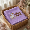 Purple Lillian Anne Goose Blanket Nestled In Wicker Basket