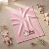 Pink Lillian Anne Baby Blanket Styled With Flowers And Toys