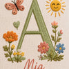 Detail Of Embroidered Letter A With Butterfly And Sun
