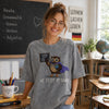 Teacher Wearing Grey Owl We Test At Dawn Embroidered Tee