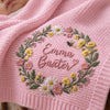 Close-up Of Pink Bobble Stitch Blanket With Floral Wreath