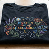 Closeup Black Shirt Showing Floral Resistance Quote Embroidery