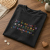 Folded Black Joy Quote Tee Styled With Daisies And Heart