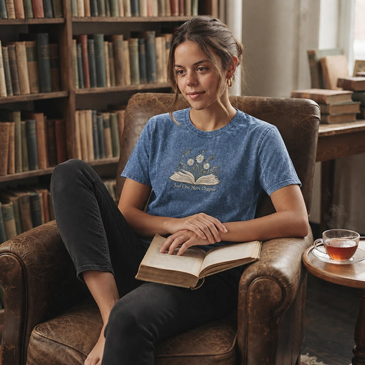 Reader Relaxing In Blue Floral Book Embroidered Tee