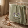 Mung Bean Personalized Blanket Draped Over White Nursery Crib