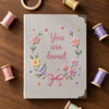 Gray Linen Notebook Framed By Pastel Embroidery Threads