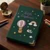 Dark Green Adventure Notebook Styled With Compass And Pencils
