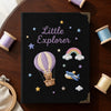 Black Travel Notebook Displayed With Colorful Thread Spools
