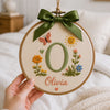 Custom Name Ornament With Floral Initial And Green Bow