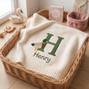 Cream Mallard Embroidered Blanket Displayed In Wicker Basket