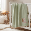 Mung Bean Bunny Initial Knit Blanket Hanging On Nursery Crib