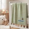 Mung Bean Bee Blanket Displayed On Crib