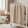 Cream Personalized Nursery Blanket Hanging On Crib