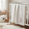 White Personalized Bunny Blanket Draped On Modern Baby Crib