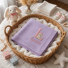 Purple Knit Baby Blanket Displayed In Wicker Gift Basket