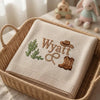 Cream Cowboy Baby Blanket Folded In Basket