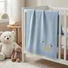 Personalized Embroidered Blue Baby Blanket On Nursery Crib