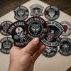 Hand Displaying Iron Rebels Road Wolves And Freedom Logos