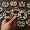 Hand Holding Lone Star Memphis And Texas Barbecue Badges