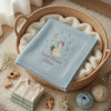 Light Blue Olivia Blanket Styled With Newborn Clothing And Yarn
