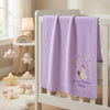 Purple Olivia Blanket Hanging Over Crib With Star Decorations