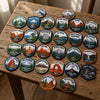 Explorer Souvenirs Arranged Across A Sunlit Rustic Wooden Table