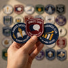 Hand Presenting Honors Debate And Business Club Patches